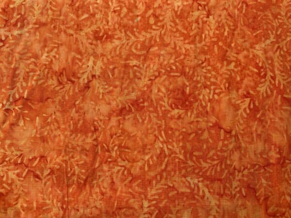 Patchwork stof - orange batik med bladmønster
