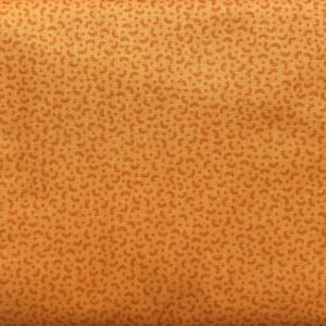 Patchwork stof - gulorange med lille mønster