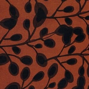 Patchwork stof - rust orange med bladmønster