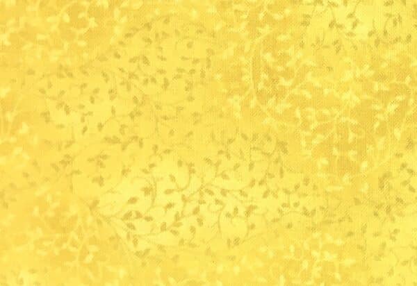Patchwork stof - gul med bladmønster