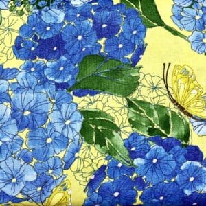 Patchwork stof - stof med blå blomster og sommerfugle