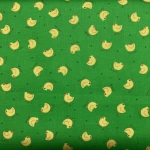 Patchwork stof - grøn baggrund med gule kyllinger