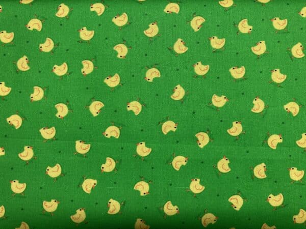 Patchwork stof - grøn baggrund med gule kyllinger