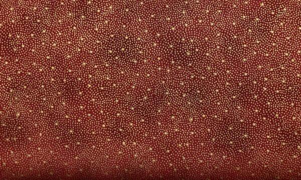 Patchwork stof - mørkerød baggrund med guldstjerner