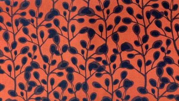 Patchwork stof - orange med sort mønster